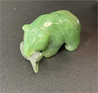 Alaskan Kobuk jade carved bear who has caught a la