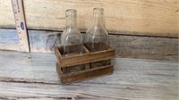 2 old bottles and wooden crate
