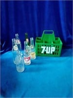 Collectible glass bottles and 7UP plastic bottle