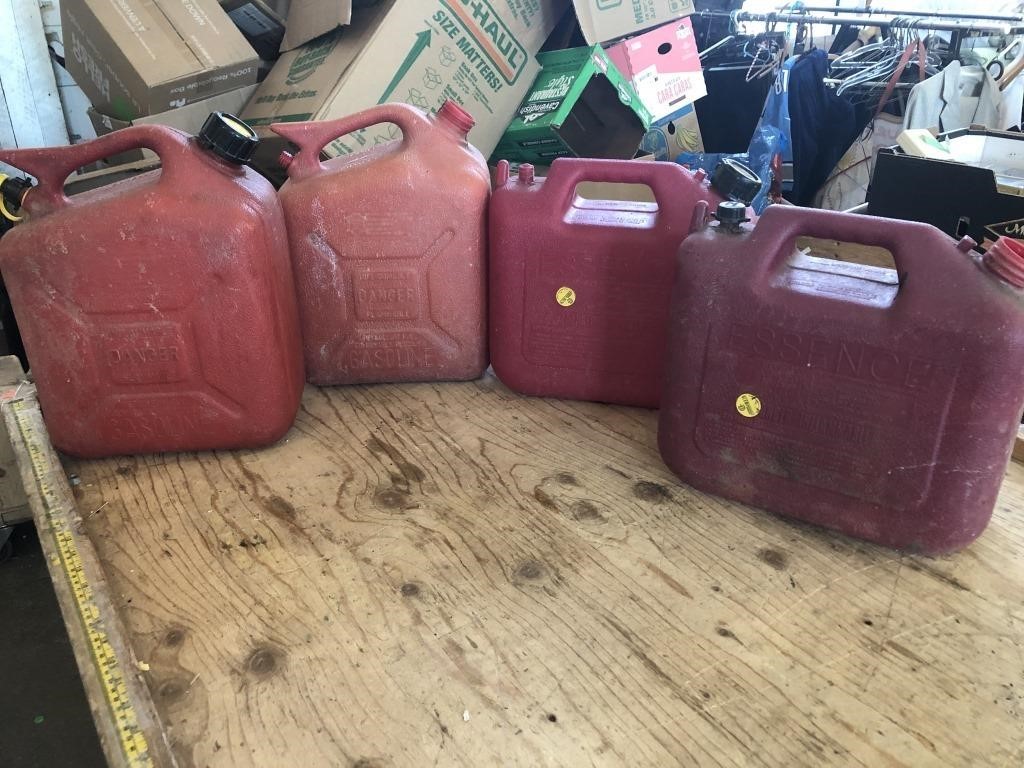 4 Gas Cans, Two Missing Caps.