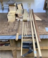 Assortment of cut wood pieces and dowel rods