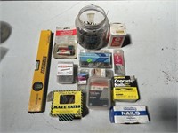 Various types of nails & screws & level
