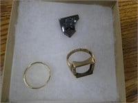 14 K gold band ring and damaged 10K ring shows wea