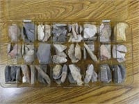Case of flint chips and broken arrowheads and othe