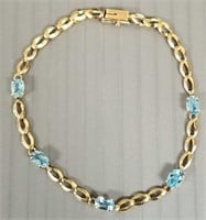 10K gold bracelet set with blue topaz - 2.7 grams