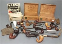 Collection of vintage smoking pipes in cigar boxes