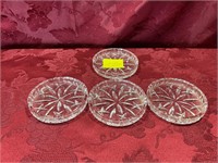 Four 3 1/2 inch crystal coasters