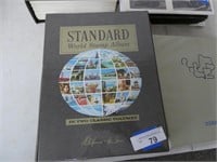 Standard world stamp album with some stamps