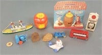 Small group of miniature toys including a Kewpie