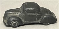 Vintage cast coupe car.