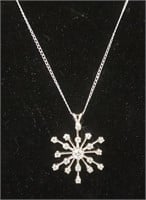 14K white gold starburst pendant set with