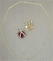 1 - 14K gold & 1 -10K gold pendants set with red