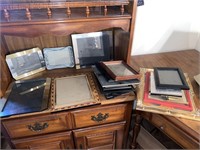 20 picture frames of various sizes and styles