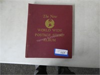 World Wide Postage Stamp Album with a few stamps