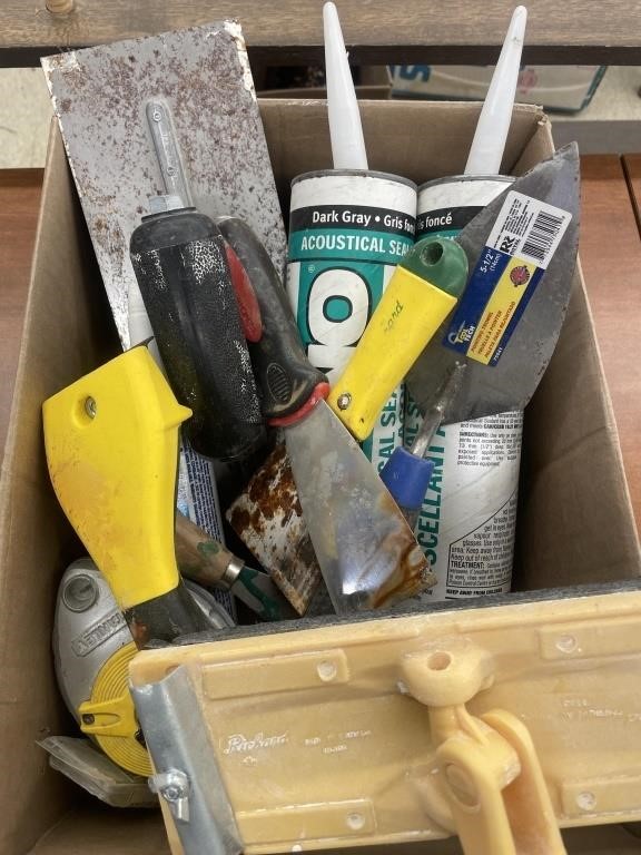 Assortment of paint and plaster tools and
