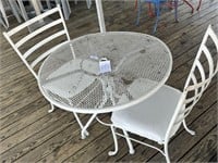 Wrought iron table with 2 padded chairs
