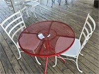 Wrought iron table with 2 padded chairs