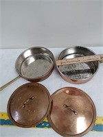 2 copper pots with lids