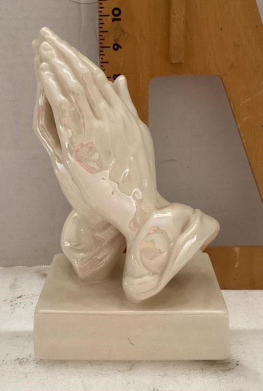 Ceramic praying hands sculpture