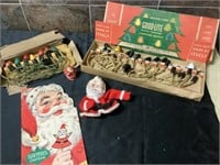 Vintage Christmas lights, book, and santas