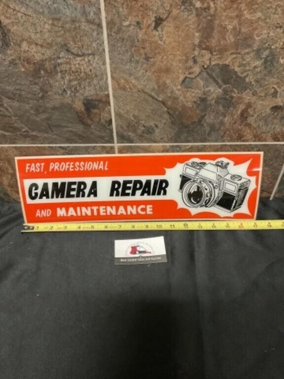 Camera repair sign