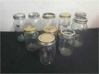 Assorted canning jars and a Kirkland Peach jar