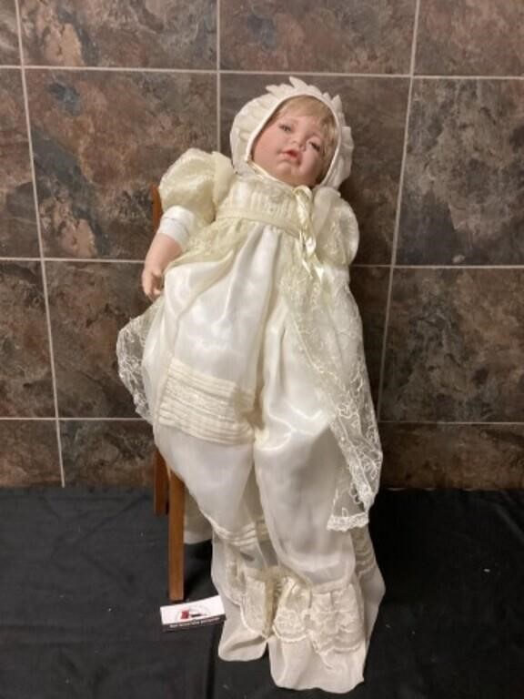Vintage doll in chair