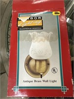 Antique brass wall light. New in box