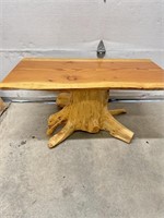 Live edge coffee table with stump base. 40“ x 22“