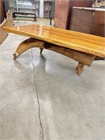 Live edge coffee table on a log base. 45“ x 24“
