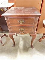 Antique mahogany nightstand with Cabriolet legs.