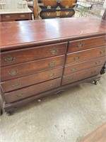 Antique mahogany dresser with eight drawers. 57”