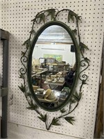 oval wall mirror with metal frame with bamboo