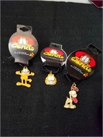 Three collectible Garfield Paws necklaces