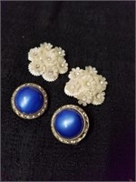 Two pairs of vintage clip-on earrings the white