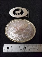 Two belt buckles one is stamped W made in USA and