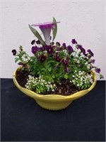 Super cute planter with purple flowers and a
