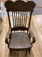 Ornate wooden rocking chair