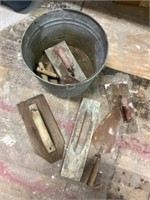 Hand trowels and galvanized bucket