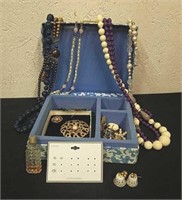 Small jewelry box with vintage jewelry, perfume,