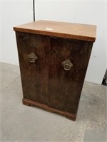 A one drawer inside a two-door bronze Walnut