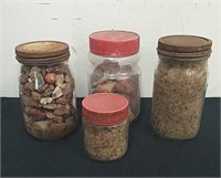 Four jars with gems