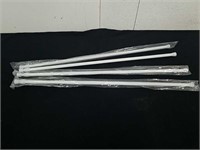 Four small tension curtain rods