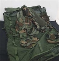 Two military vests with pouches and carrying bag