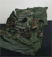 Two military vests with pouches and carrying bags