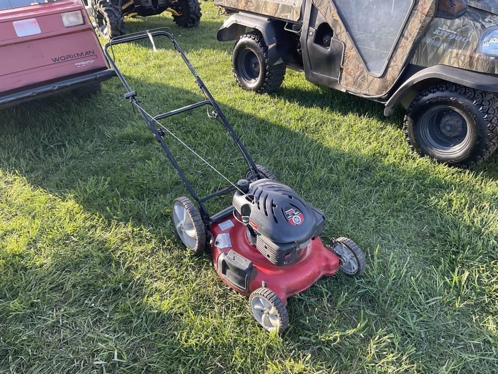 Push mower that is red in color