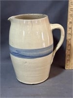 Stoneware pitcher with blue stripe