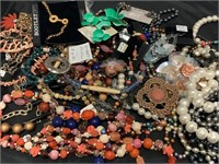 Assorted costume jewelry and more.