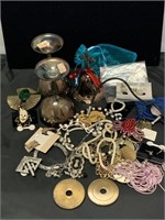 Assorted costume jewelry and more.