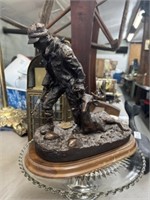 NRA deer hunter statue